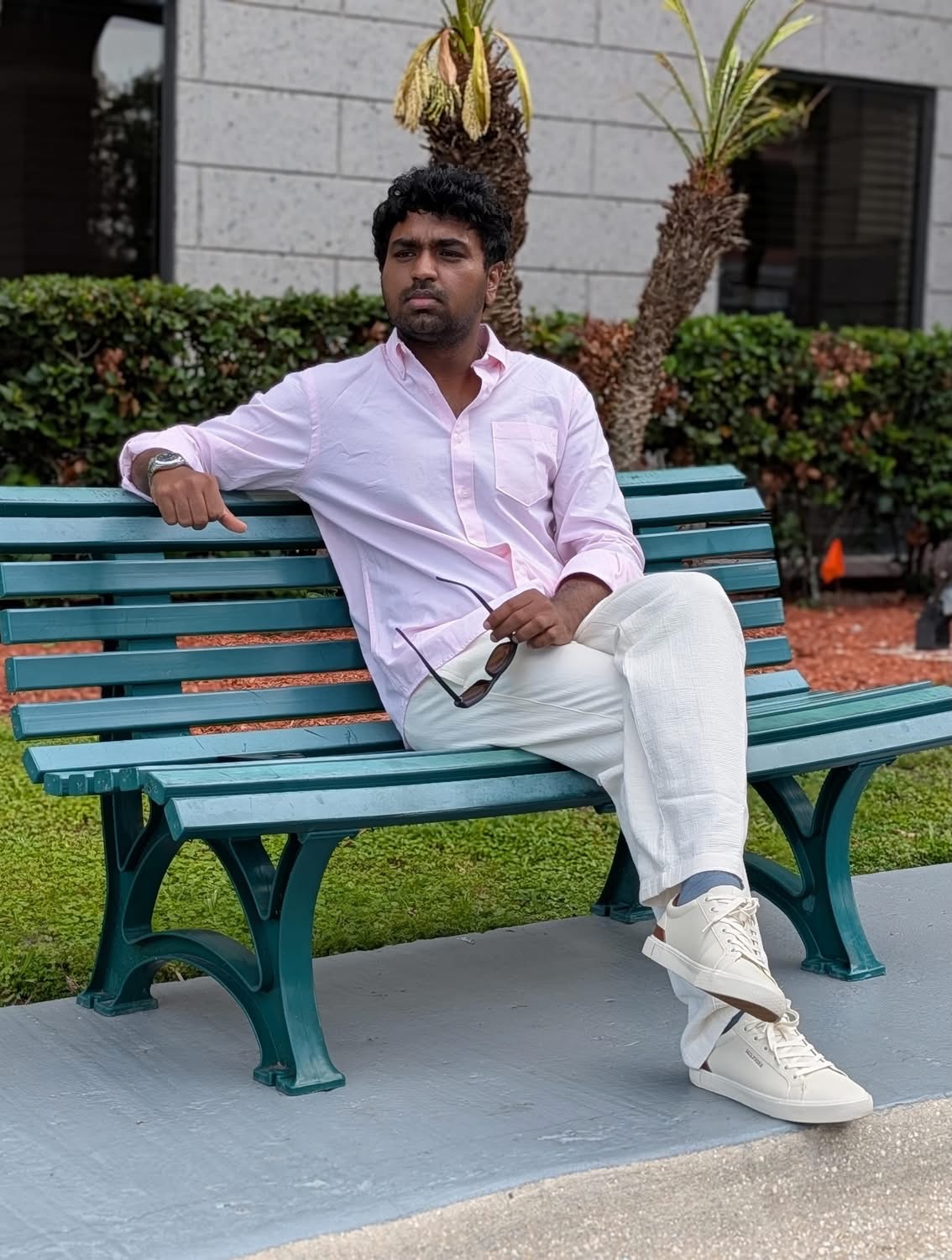Nahid Hasan seated outdoors